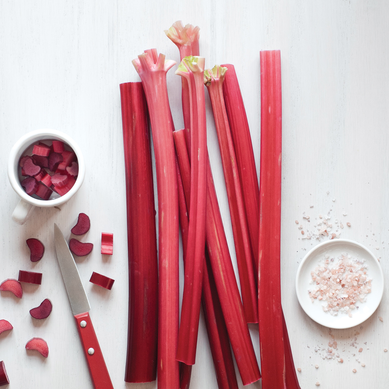 Rhubarb stalks with sliced rhubarb and pink salt